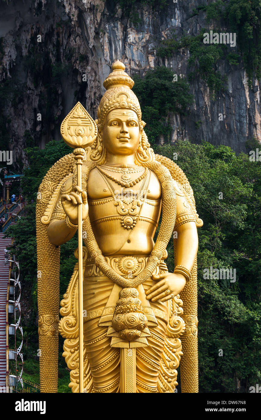 The statue of Lord Murugan that stands outside of the Batu Caves north of Kuala Lumpur, Malaysia. Stock Photo