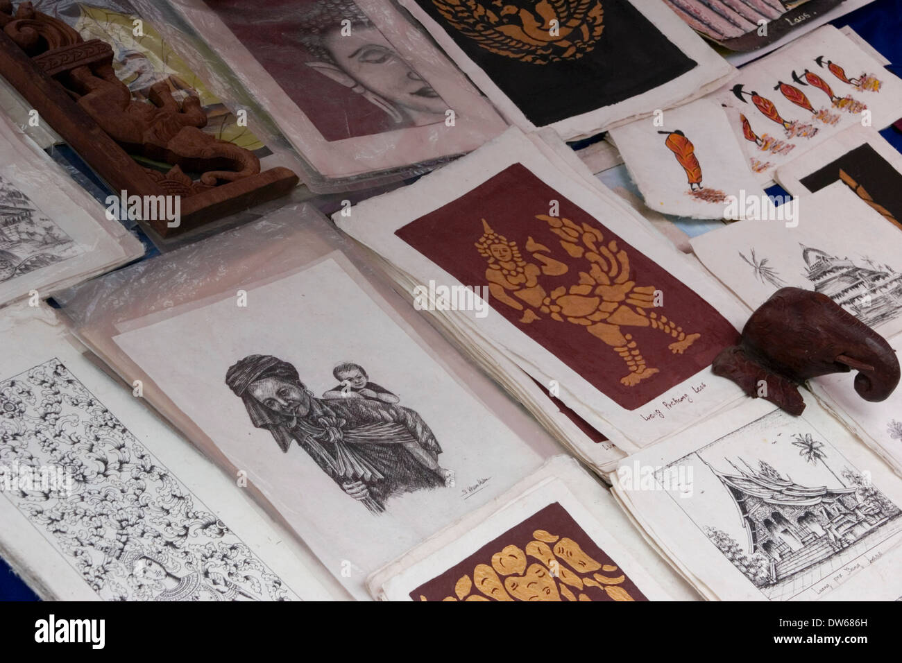 Art work by Laotian artists is for sale at a Buddhist temple in Luang Prabang, Laos Stock Photo