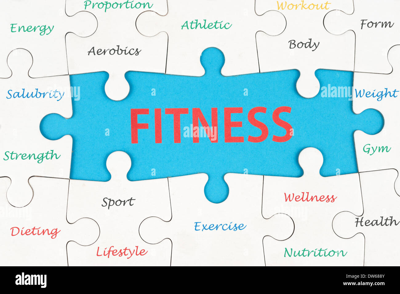Fitness concept word cloud on group of jigsaw puzzle pieces Stock Photo