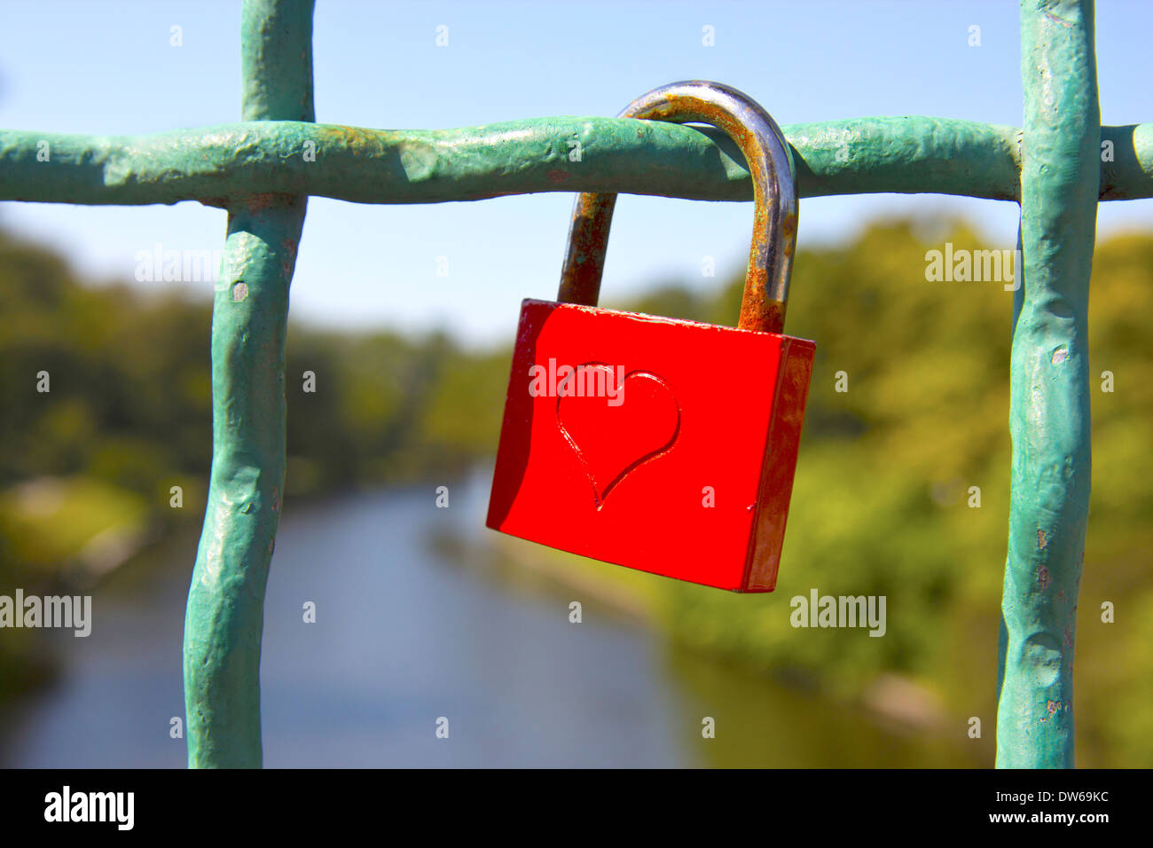 Red love lock with embossed heart. Stock Photo