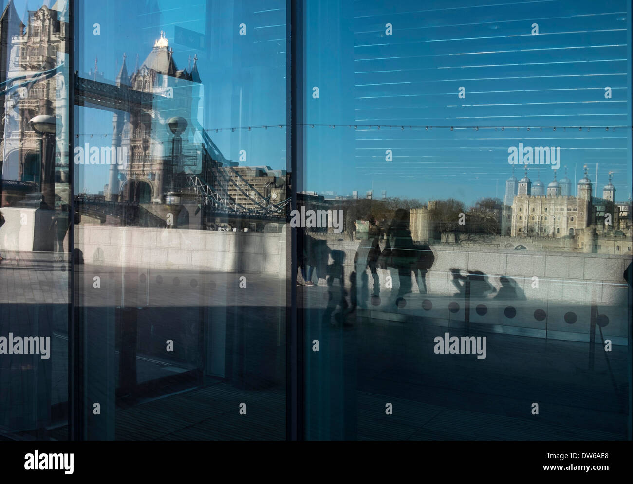 Reflections of Tower Bridge and The Tower of London in a large window. Stock Photo
