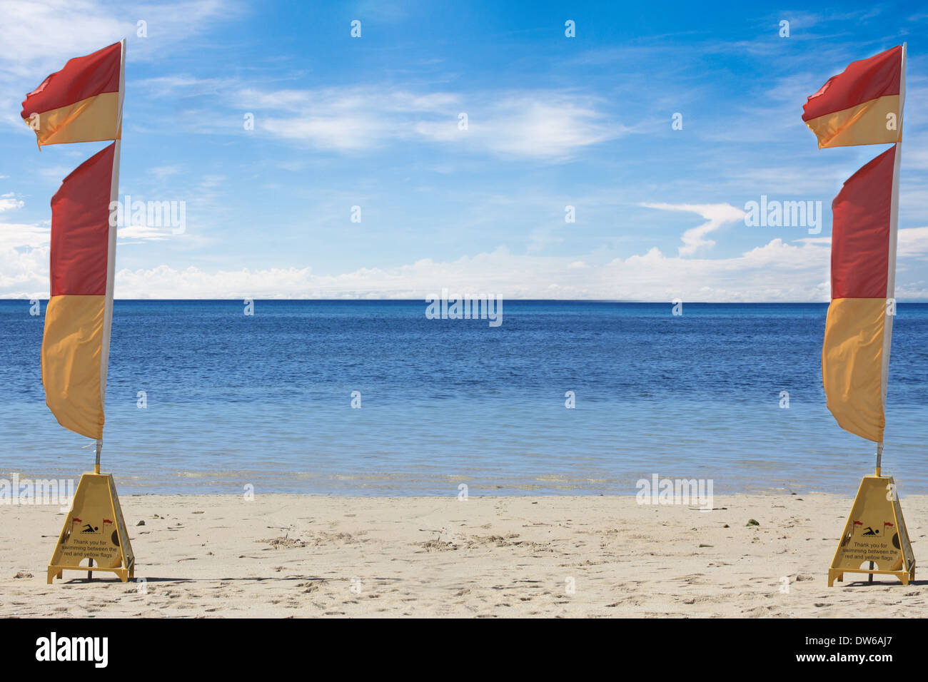 two lifesaving flags on a tropical beach in Australia Stock Photo