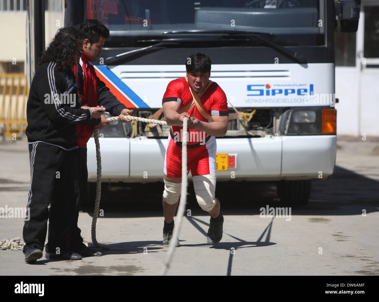 Kabul. 1st Mar, 2014. An Afghan sportsman pulls a bus during a ...