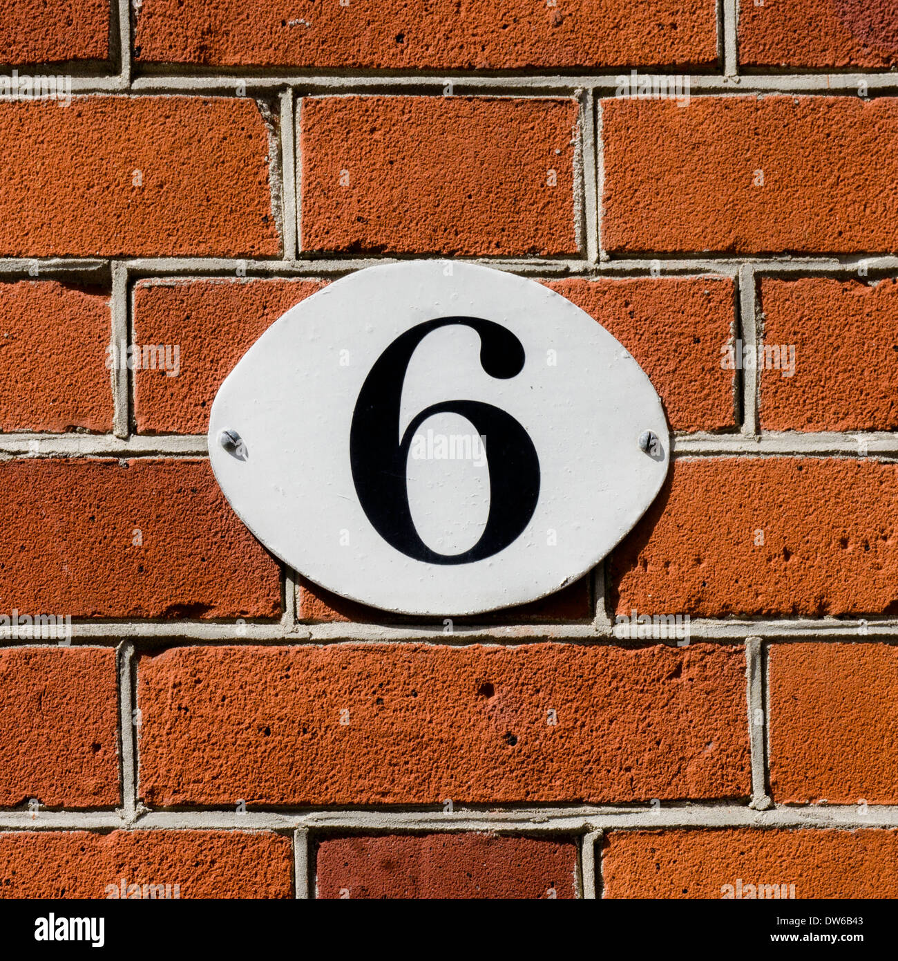 new house number six on an oval plate Stock Photo