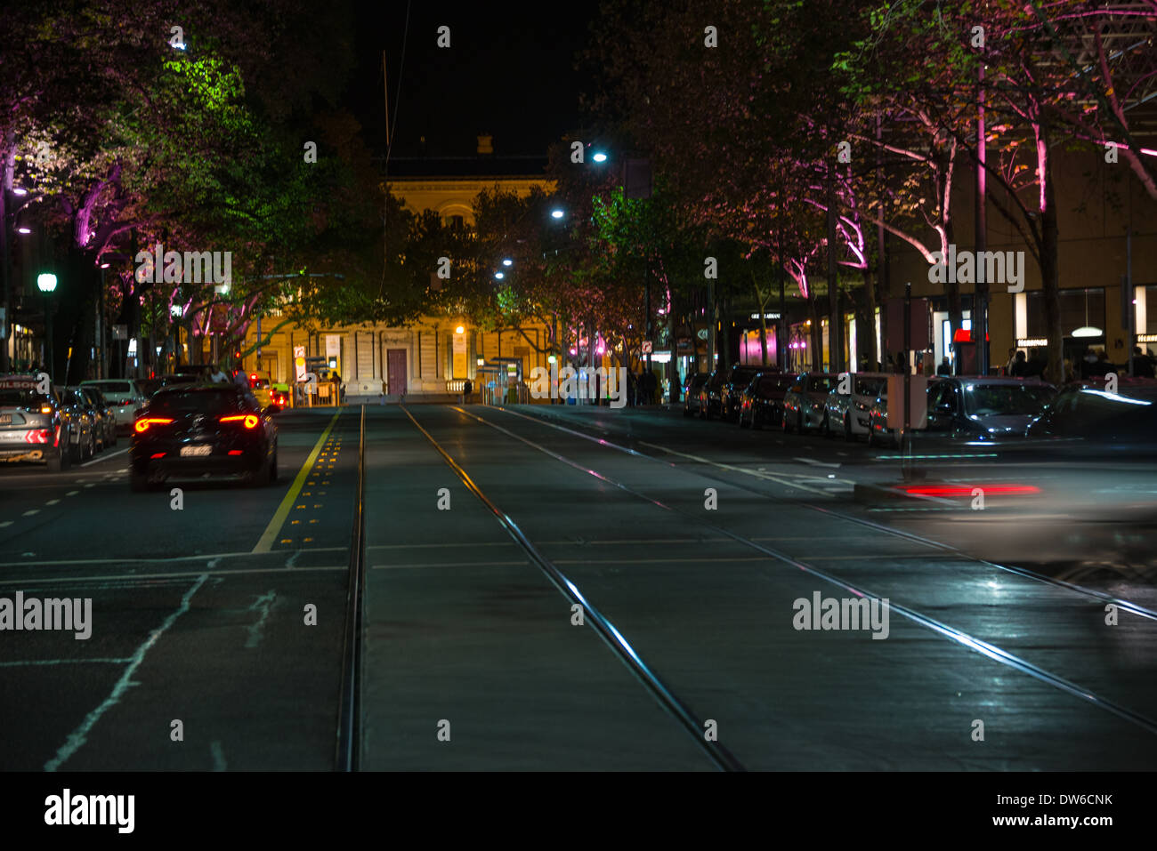 Collins street melbourne looking north to spring steet and parliment  treasury offices at night with bright lights Stock Photo - Alamy
