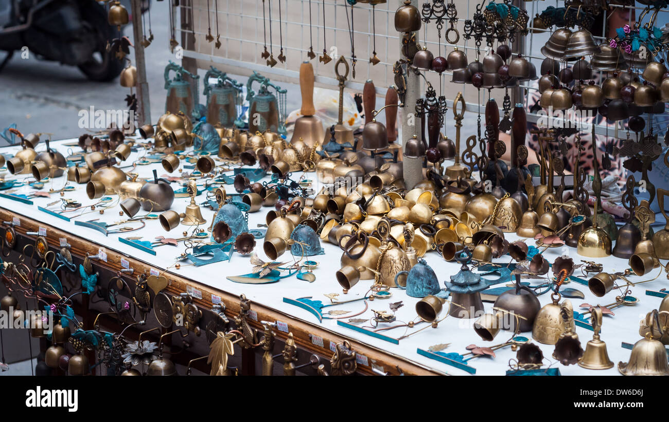 A vendor in Insadong, Seoul, sells little brass bells and other knick knacks. Stock Photo