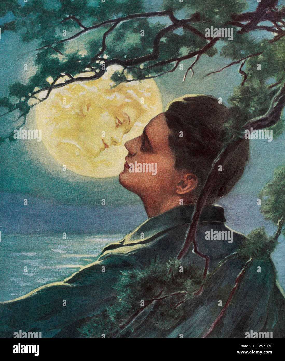 The girl in the moon, man about to kiss a woman's face in the moon, circa 1909 Stock Photo