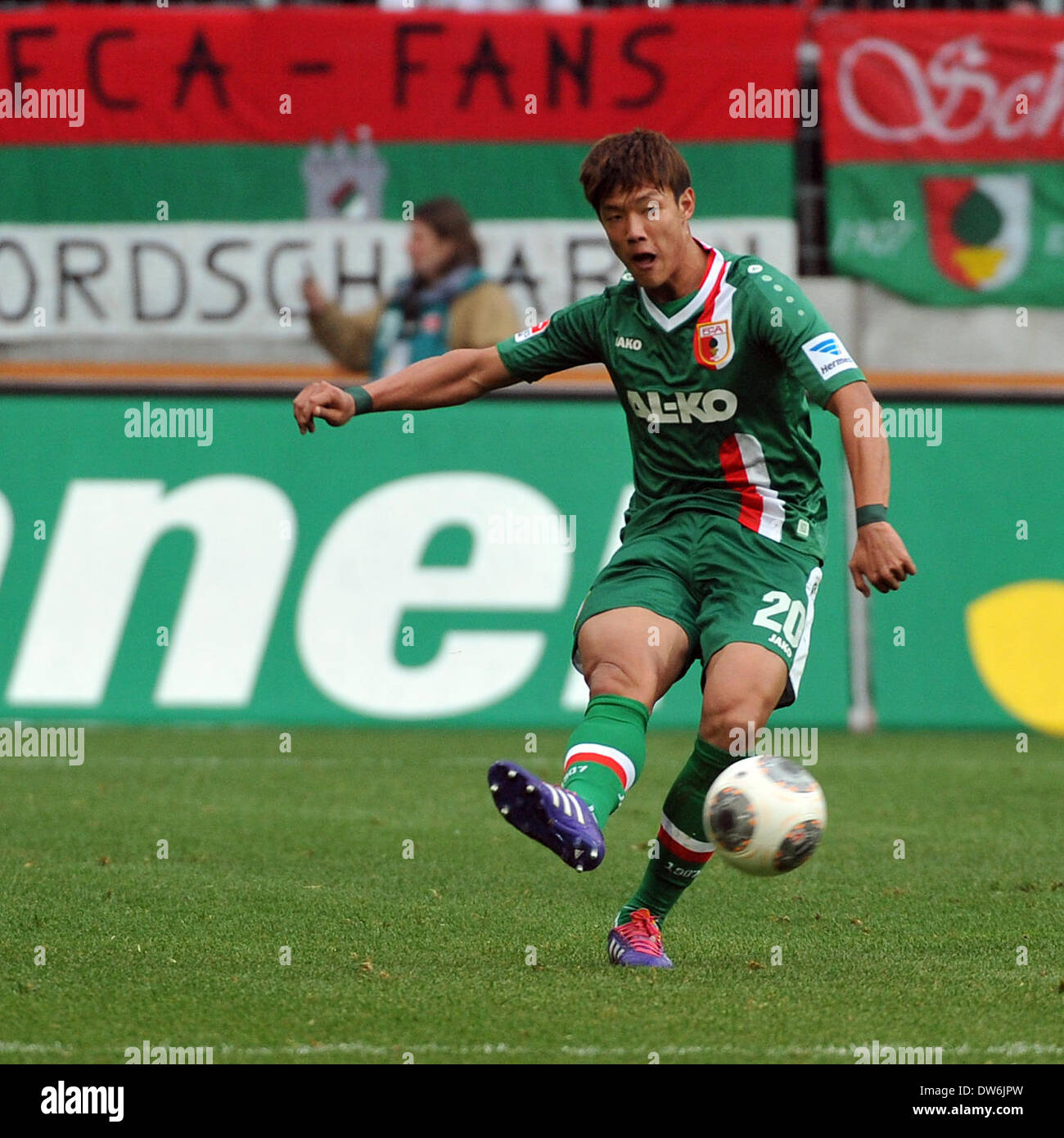 Augsburg's Jeong- Ho Hong vies for the ball during the Bundesliga soccer match FC Augsburg vs Hanover 96 at SGL-Arena in Augsburg', Germany, 01 March 2014. The match ended with 1-1. Photo: Stefan Puchner/dpa (ATTENTION: Due to the accreditation guidelines, the DFL only permits the publication and utilisation of up to 15 pictures per match on the internet and in online media during the match.) Stock Photo