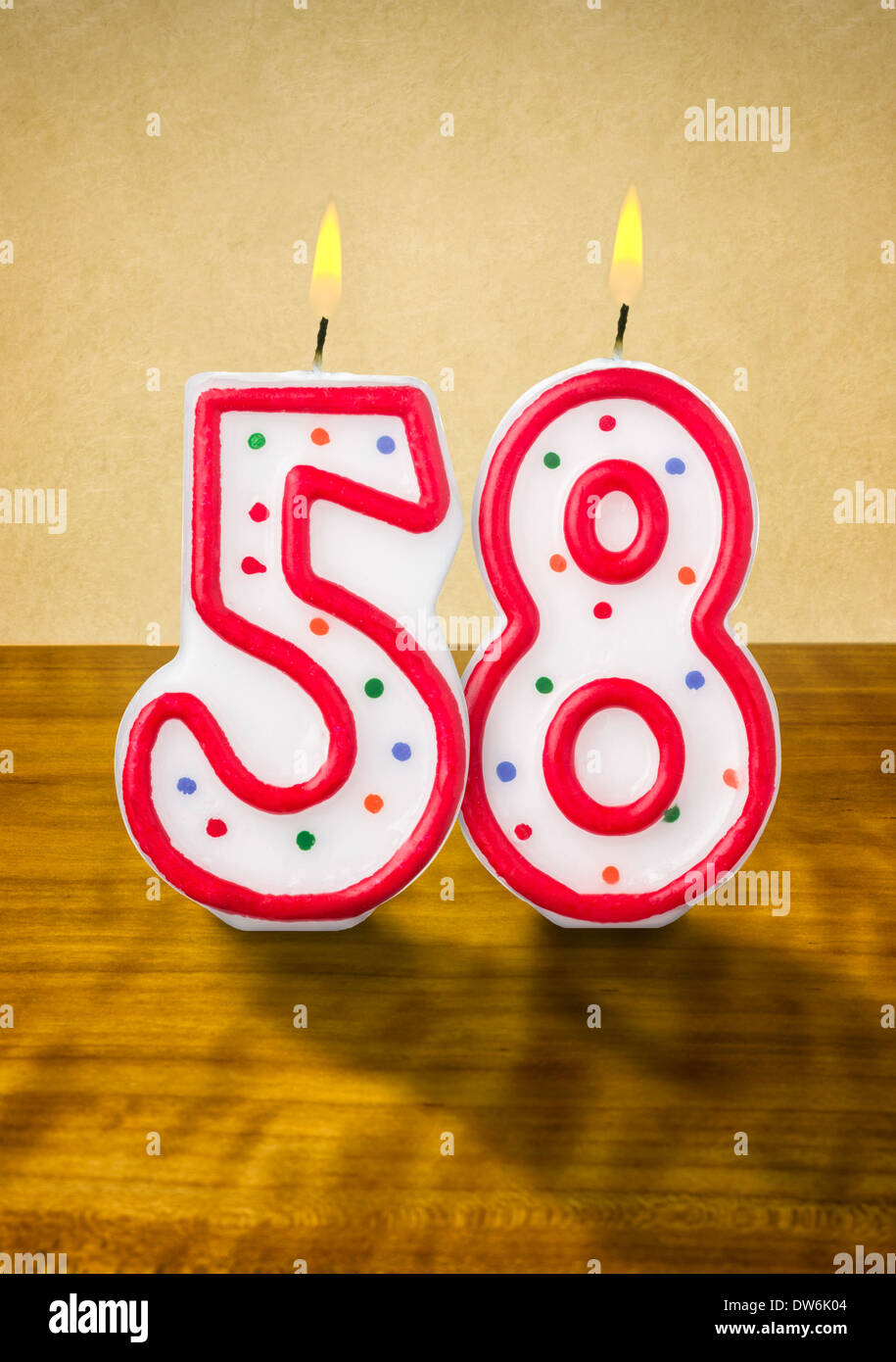 Burning birthday candles number 58 Stock Photo - Alamy