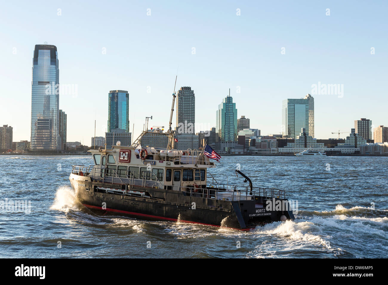 U.S. Army Corps of Engineers Patrol Boat, Hudson River in Front of Jersey  City skyline, NYC, USA Stock Photo