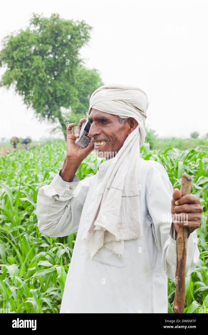 1 Indian farmer standing and talking Stock Photo - Alamy