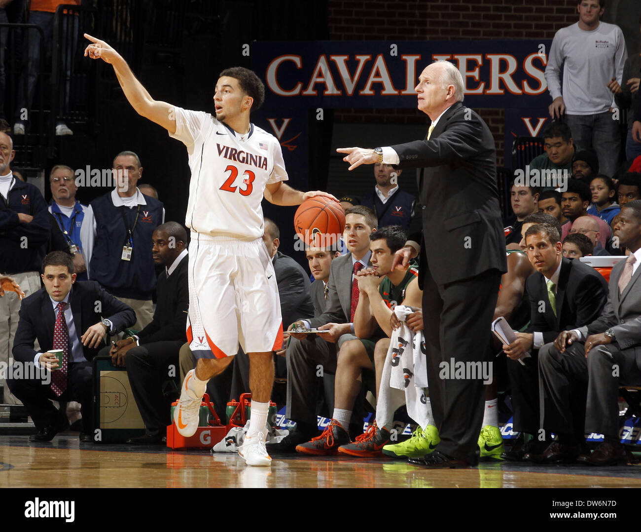 Charlottesville, Virginia, UNITED STATES, . 26th Feb, 2014. Virginia guard London Perrantes (23) and Miami head coach Jim Larra''“aga during an NCAA basketball game Saturday Feb, 24, 2014 in Charlottesville, VA. Virginia defeated Miami 65-40. © Andrew Shurtleff/ZUMAPRESS.com/Alamy Live News Stock Photo