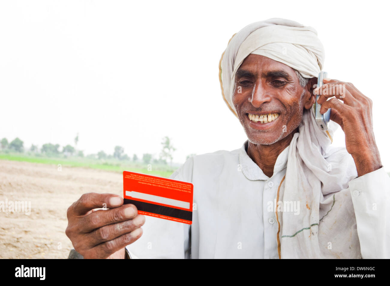 1 Indian farmer showing credit card Stock Photo: 67146140 - Alamy