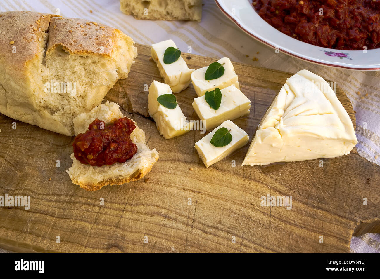 Homemade chutney, freshly baked bread and fresh white cheese Stock Photo