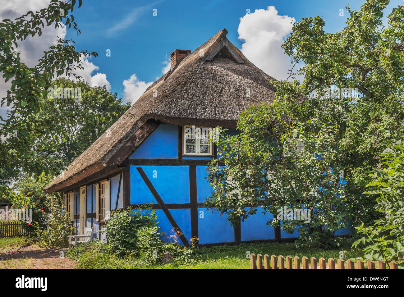 Blue half-timbered house with thatched roof in Warthe, Island of Usedom, Mecklenburg-Western Pomerania, Germany, Europe Stock Photo