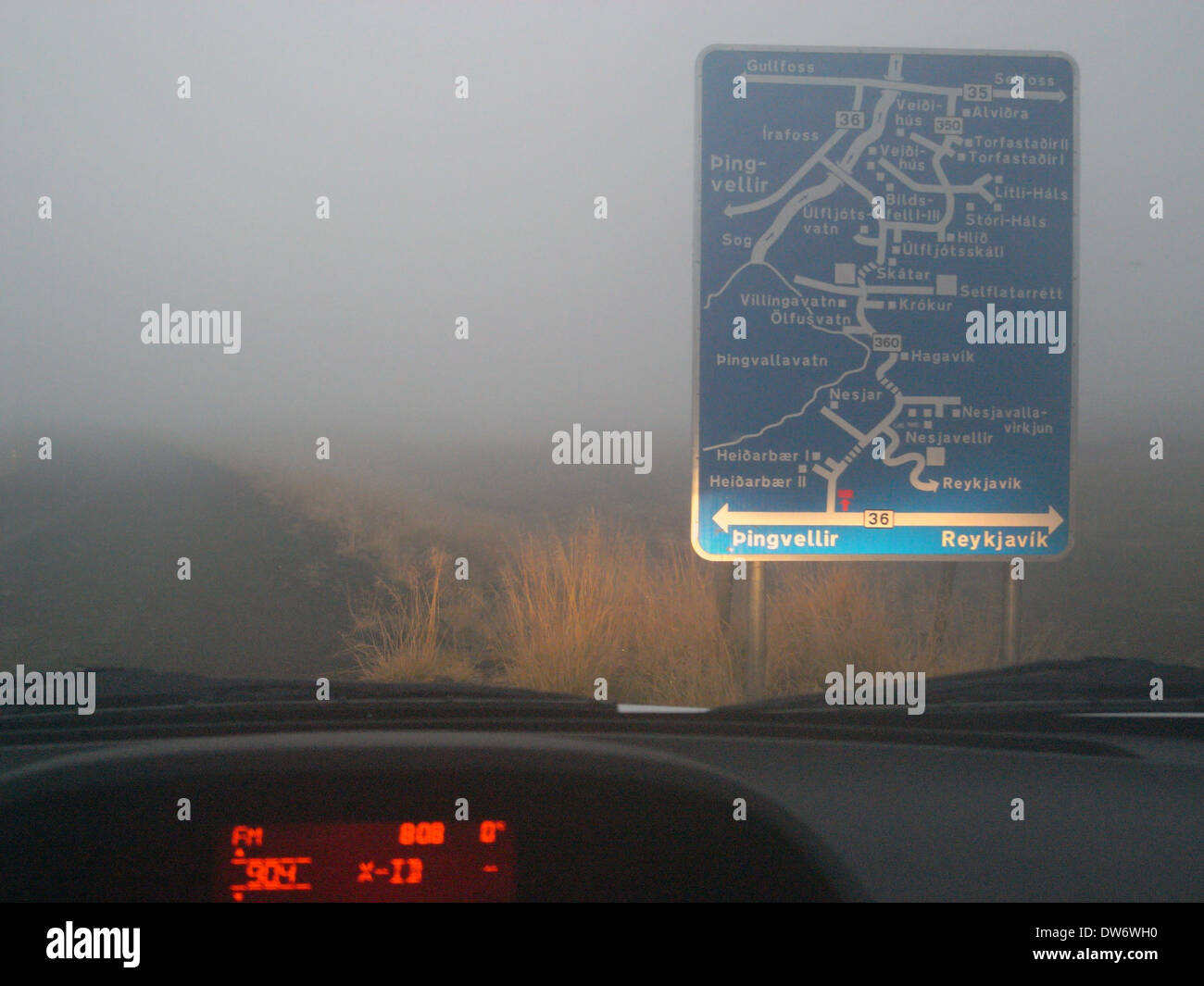 Complicated road sign in fog, near Pingvellir National Park, Iceland  Stock Photo