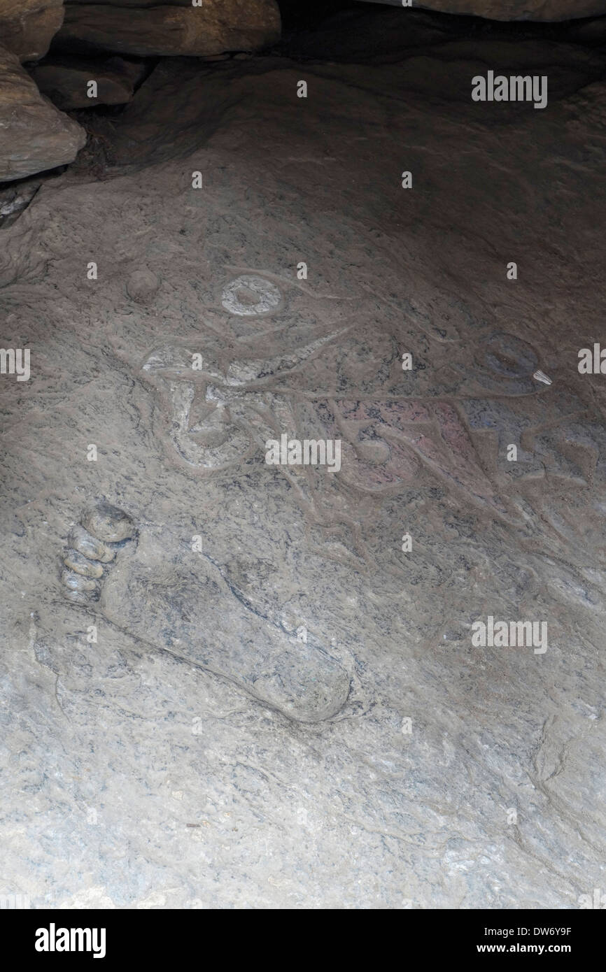 Footprint in rock slab in the Milarepa Cave shrine, Tsum Valley, Nepal. Stock Photo