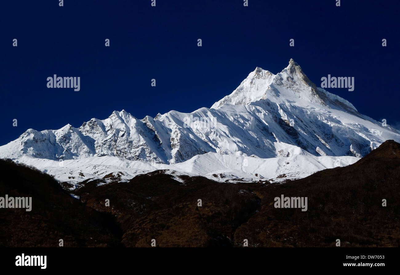 Manaslu, at 8156 meters (26,759 feet) high is the eighth highest peak on the planet. Stock Photo