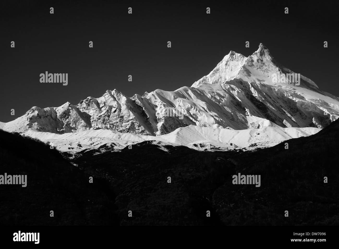 Manaslu, at 8156 meters (26,759 feet) high is the eighth highest peak on the planet. Stock Photo