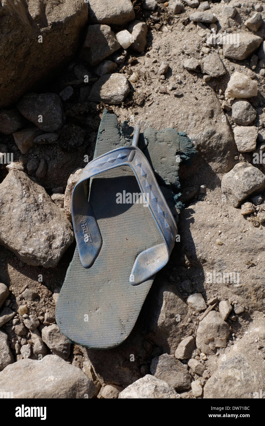 Worn Sandle Discarded On The Side Of The Annapurna Road In The Gorkha Region Of Nepal Stock 