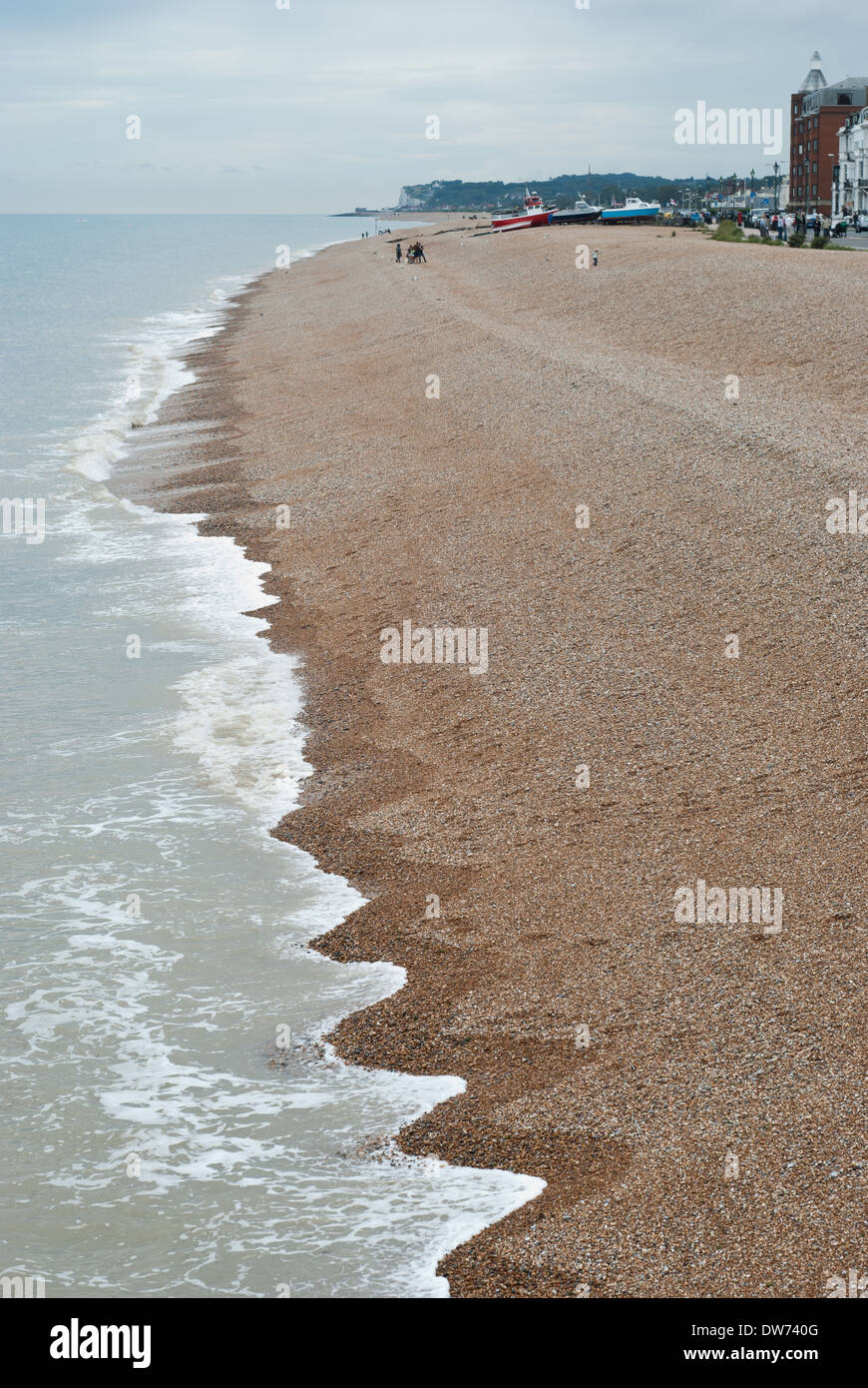The sea laps against the pebble beach near the English seaside town of Deal in Kent. Stock Photo