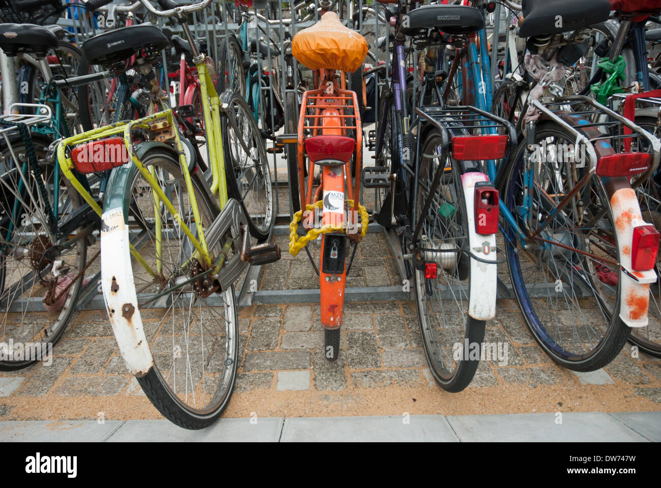 Bicycles locked up outside the Delft train station in The Netherlands. Stock Photo