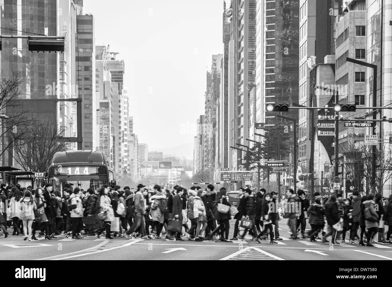 Pedestrians cross the street in the Gangnam district of Seoul, South Korea. Stock Photo