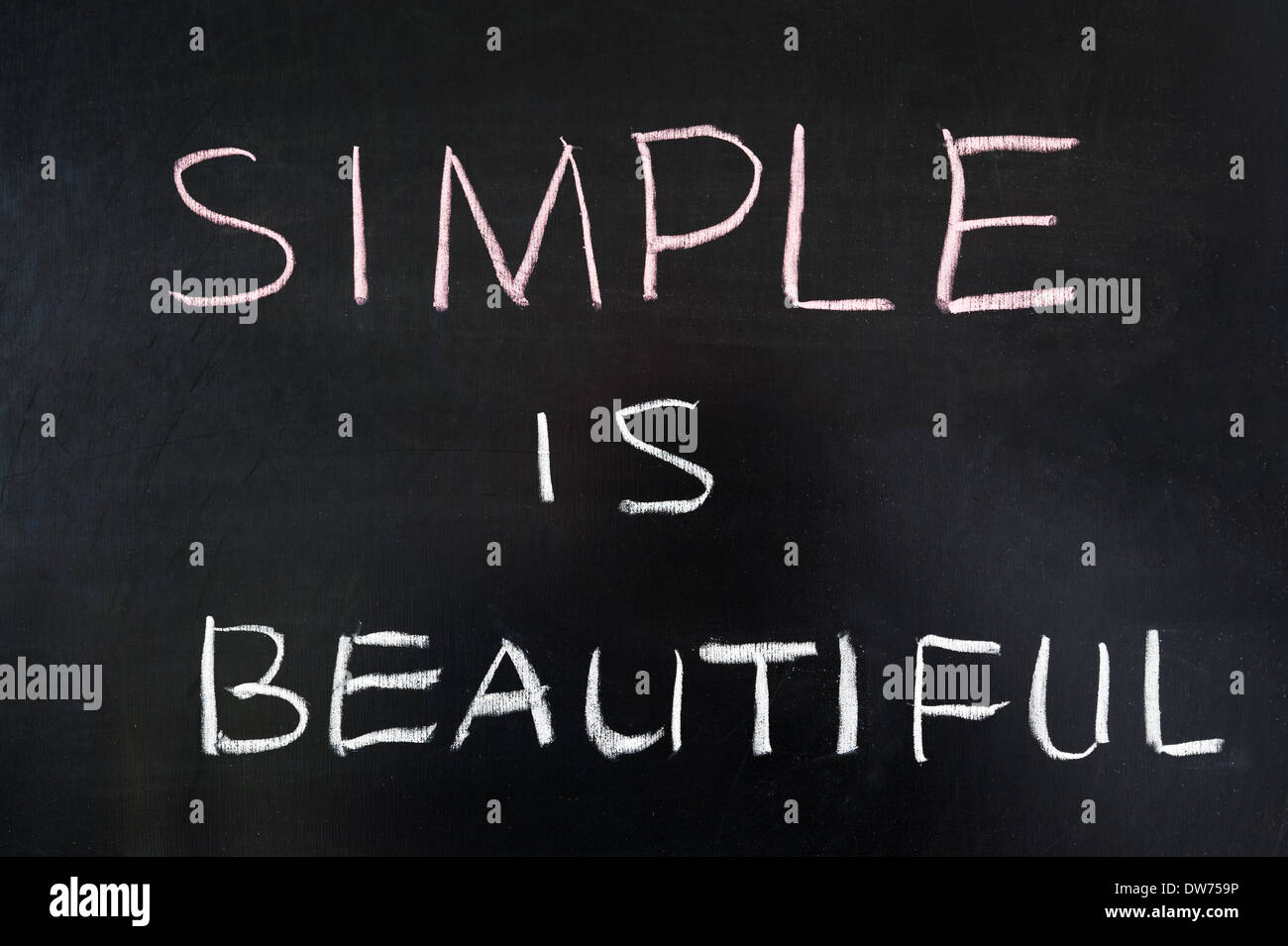 Simple is beautiful words written on blackboard Stock Photo