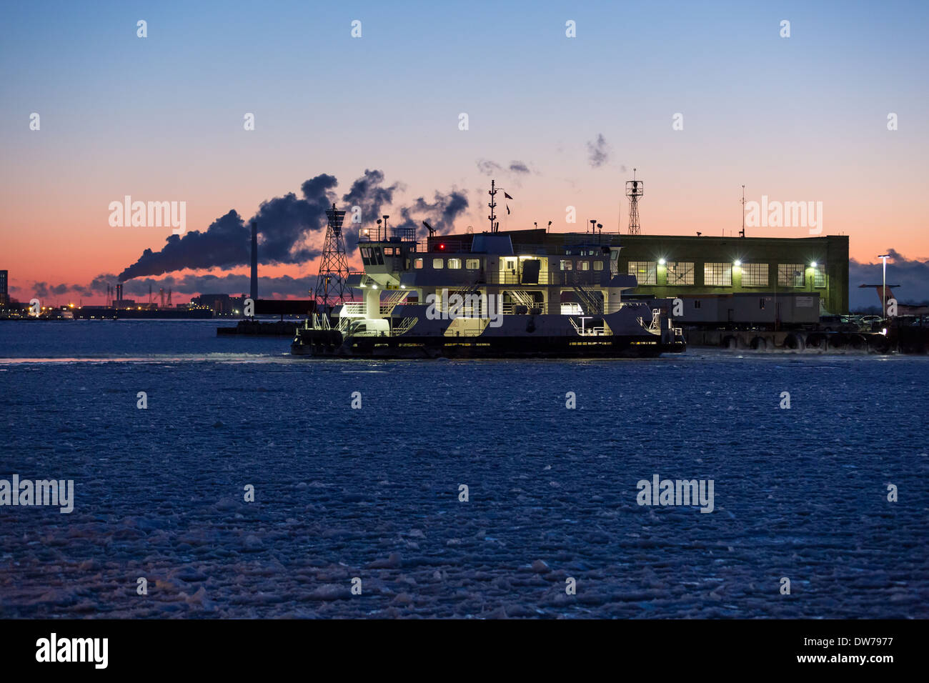 The Toronto Island AIrport Ferry crosses the frozen waters of Lake Ontario to pickup passengers