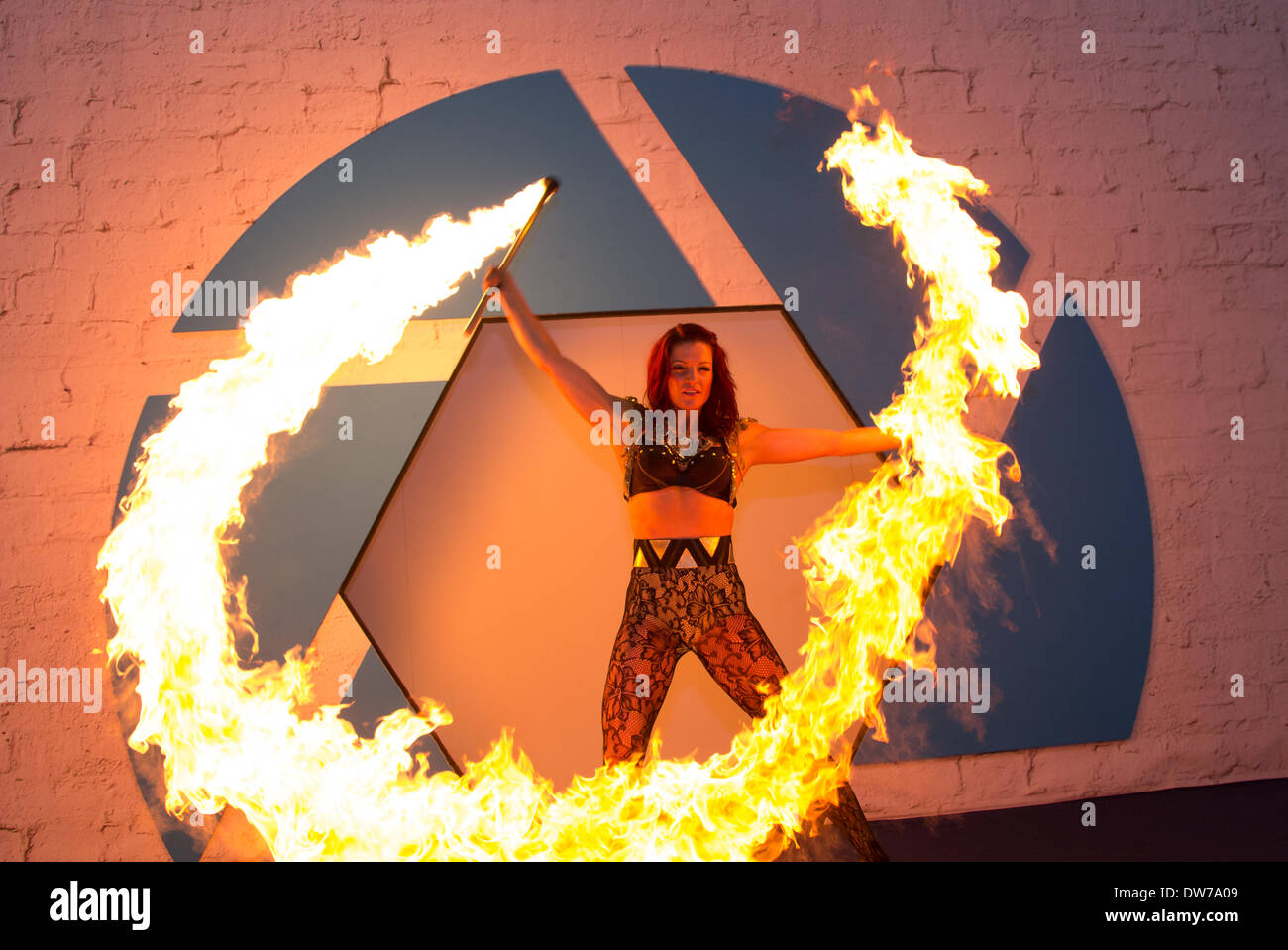 Fire artist on stage during the photography show at the NEC in Birmingham UK Stock Photo