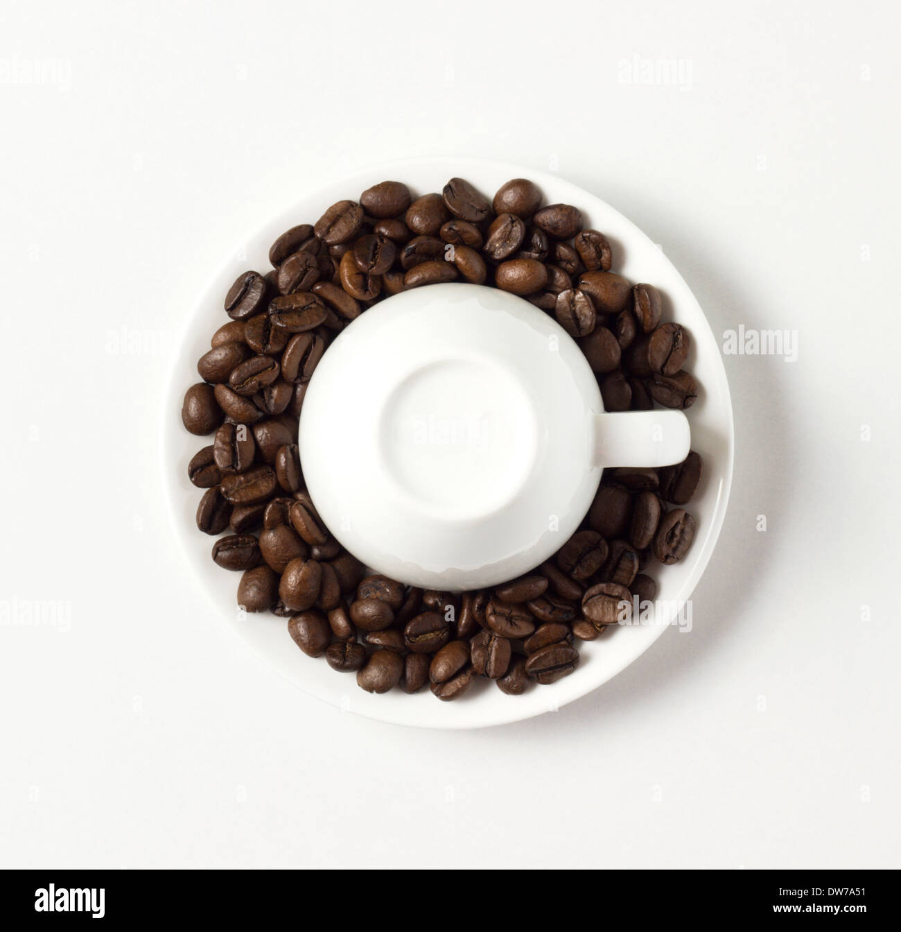 coffee cup with roasted beans on white table Stock Photo - Alamy
