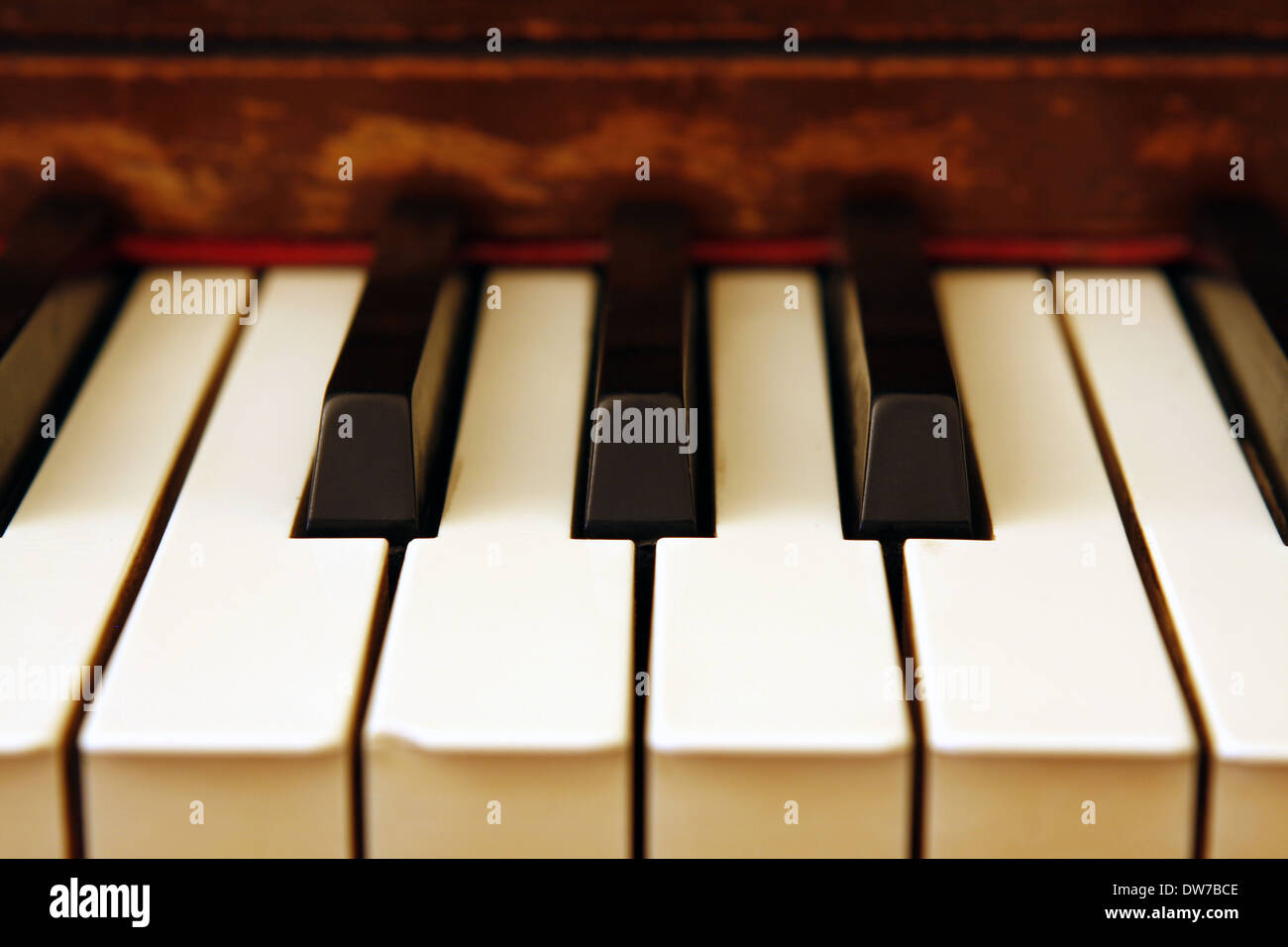 Black & white, ebony & ivory piano keyboard with vintage wood. Stock Photo