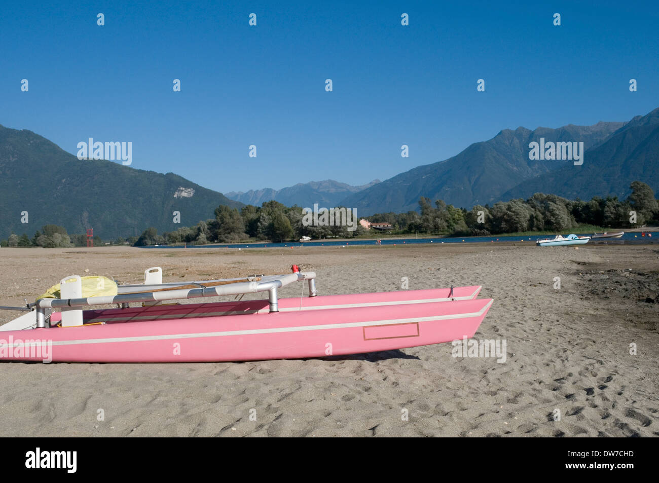 Pink catamaran on the beach, Sorico, Lake Como, Italy Stock Photo