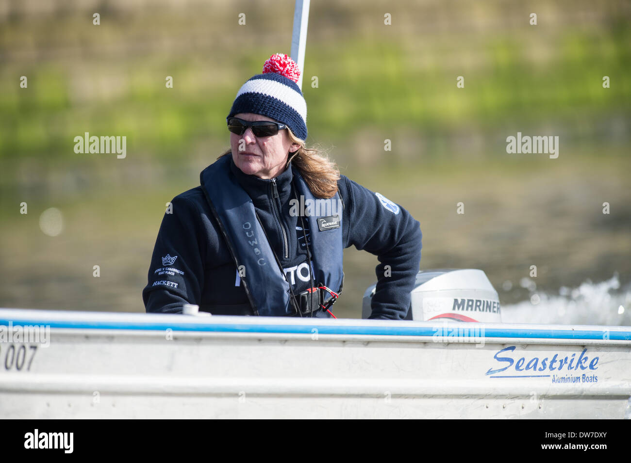 London, UK. 1st March 2014.  CLUB FIXTURE 2014 BOAT RACE SEASON.  Oxford University Women's Boat Club v Molesey Boat Club.  OUBC Coach Christine Wilson follows the Race,  OUWBC crew (blue shirts):  Bow: Elizabeth Fenje;2: Alice Carrington-Windo; 3: Maxie Scheske;4: Nadine Graedel Iberg; 5: Amber De Vere; 6: Lauren Kedar; 7: Anastasia Chitty; Stroke: Laura Savarese; Cox: Erin Wysocki-Jones.  MBC crew:  Bow: Aimee Jonckers; 2: Emma Boyns; 3: Nel Castle-Smith; 4: Victoria Watts; 5: Amber Anderson; 6: Gabby Rodriguez; 7: Karen Bennett; Stroke: Samantha Fowler; Cox: Connie Pidoux. © Dunc Stock Photo