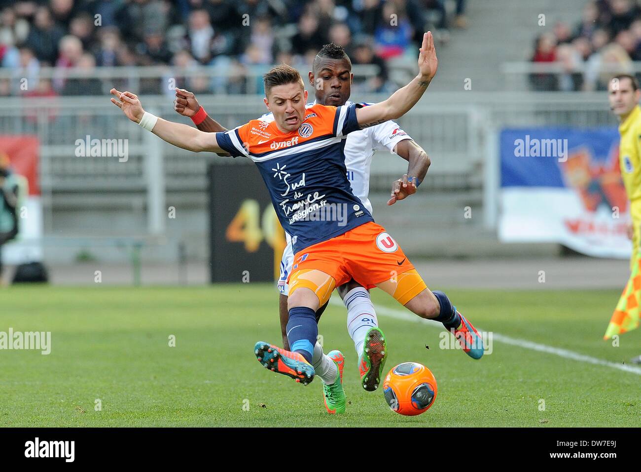 02.03.2014. French League 1 football. Lyon versus Montpellier.  Henri Bedimo (Lyon) challenges Anthony Mounier (Montpellier) Stock Photo