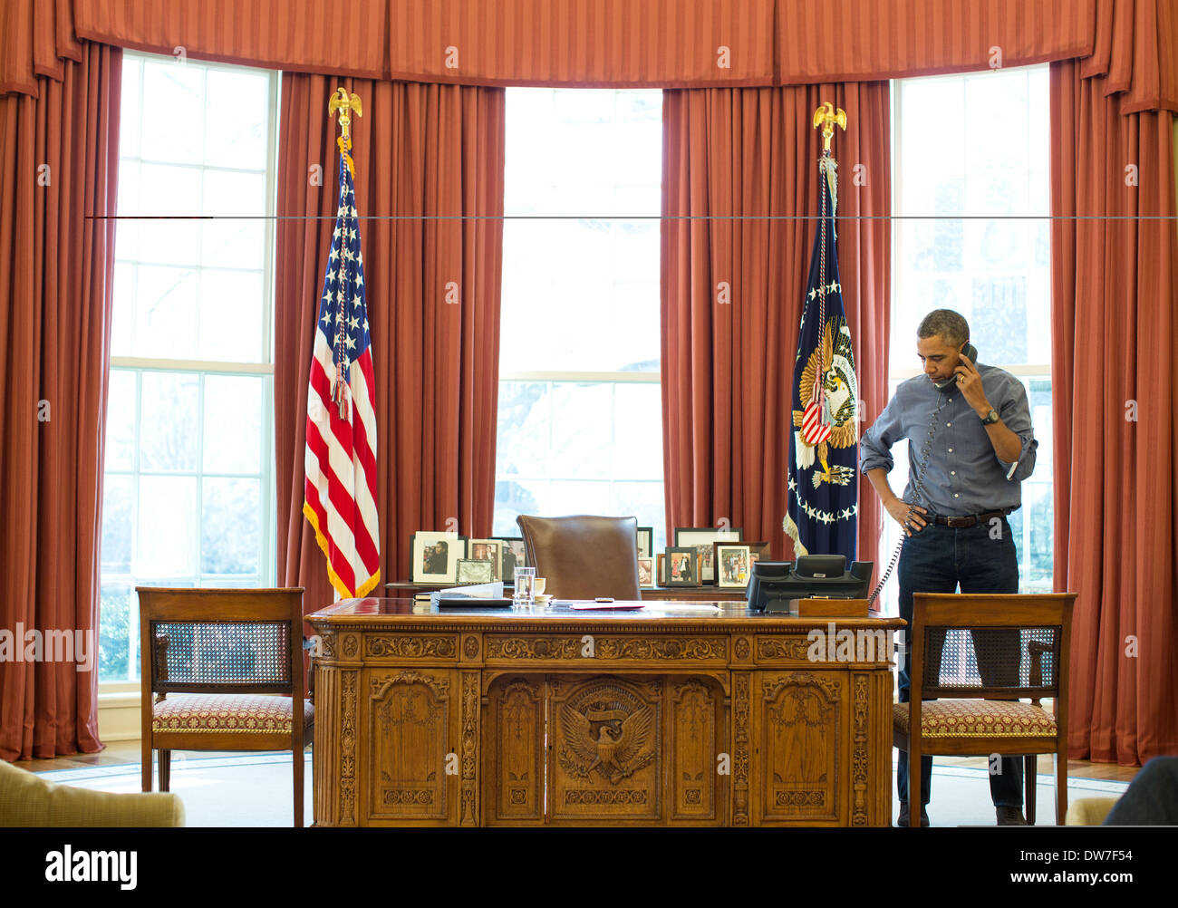 US President Barack Obama talks on the phone with Russian President Vladimir Putin about the situation in Ukraine from the Oval Office of the White House March 1, 2014 in Washington, DC. Stock Photo