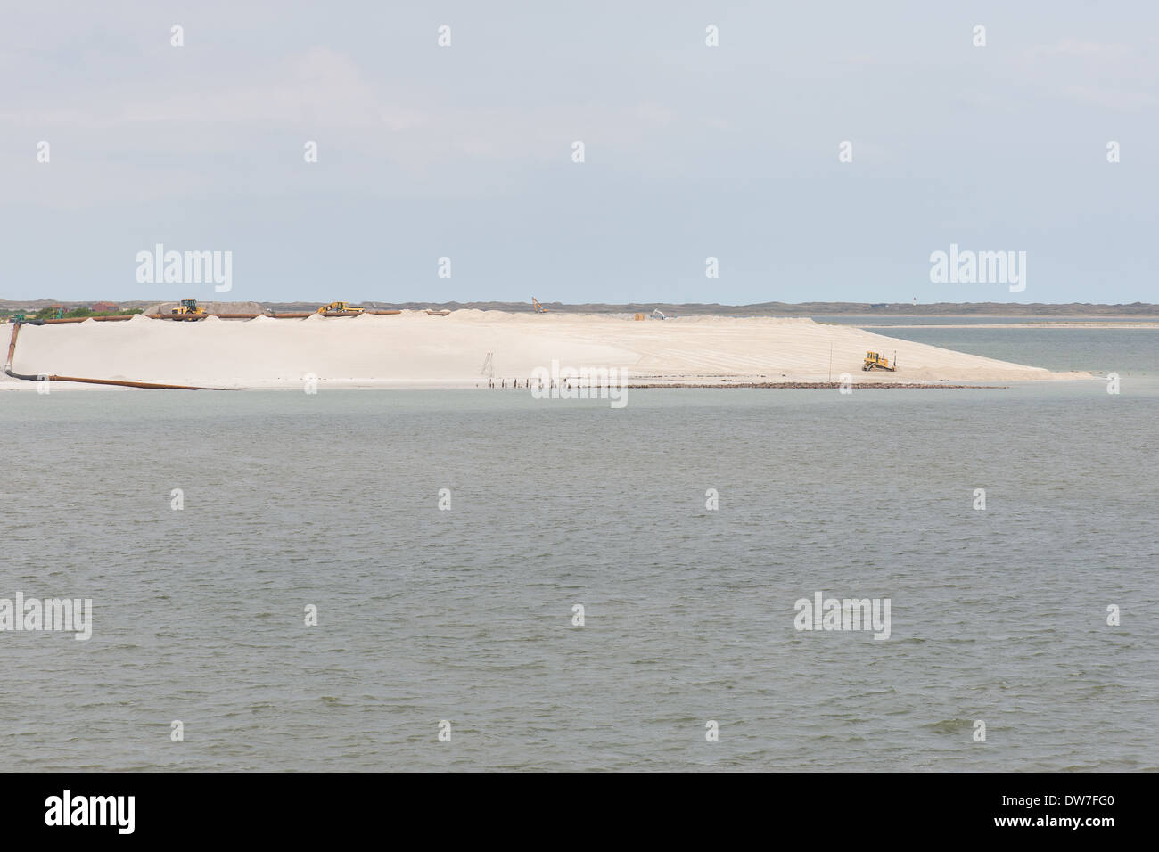 Construction work on a levee at the North Sea on the island of Sylt, Germany Stock Photo