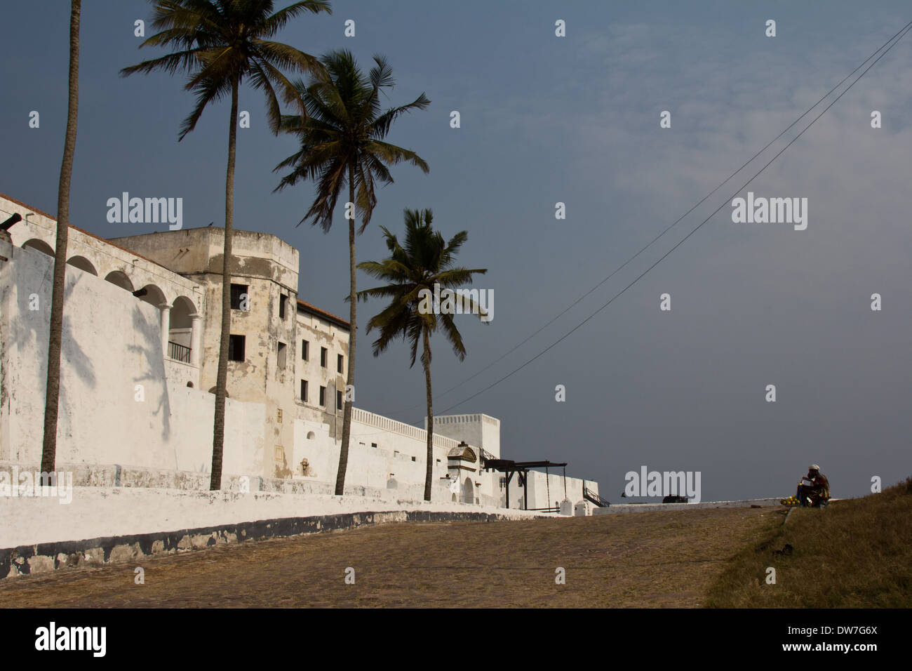Elmina Castle with palm trees in front at Cape Coast, Ghana Stock Photo