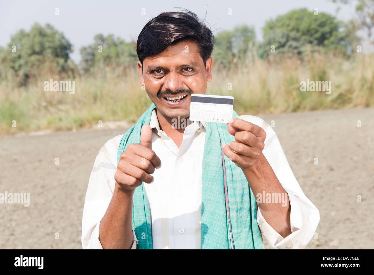 1 indian farmar showing credit card Stock Photo