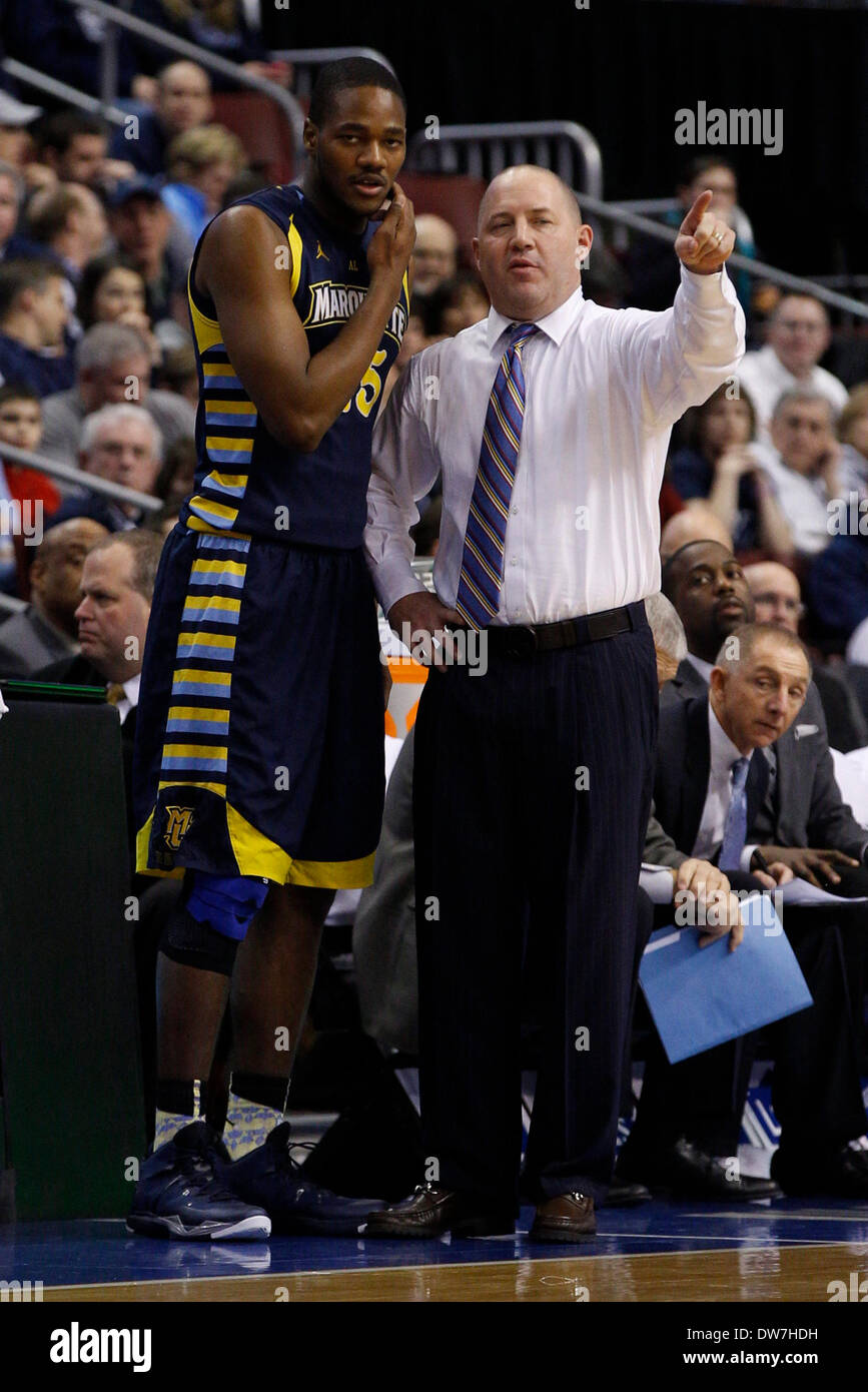 March 2, 2014: Marquette Golden Eagles head coach Buzz Williams talks things over with forward Steve Taylor, Jr. (25) during the NCAA Basketball game between the Marquette Golden Eagles and the Villanova Wildcats at the Wells Fargo Center in Philadelphia, Pennsylvania. The Villanova Wildcats won 73-56. (Christopher Szagola/Cal Sport Media) Stock Photo