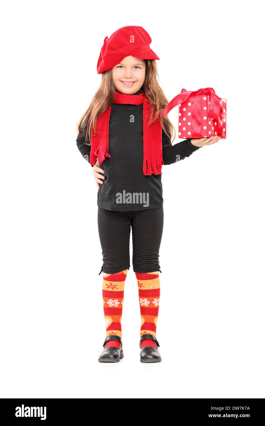 Full length portrait of a cute little girl holding a birthday present ...