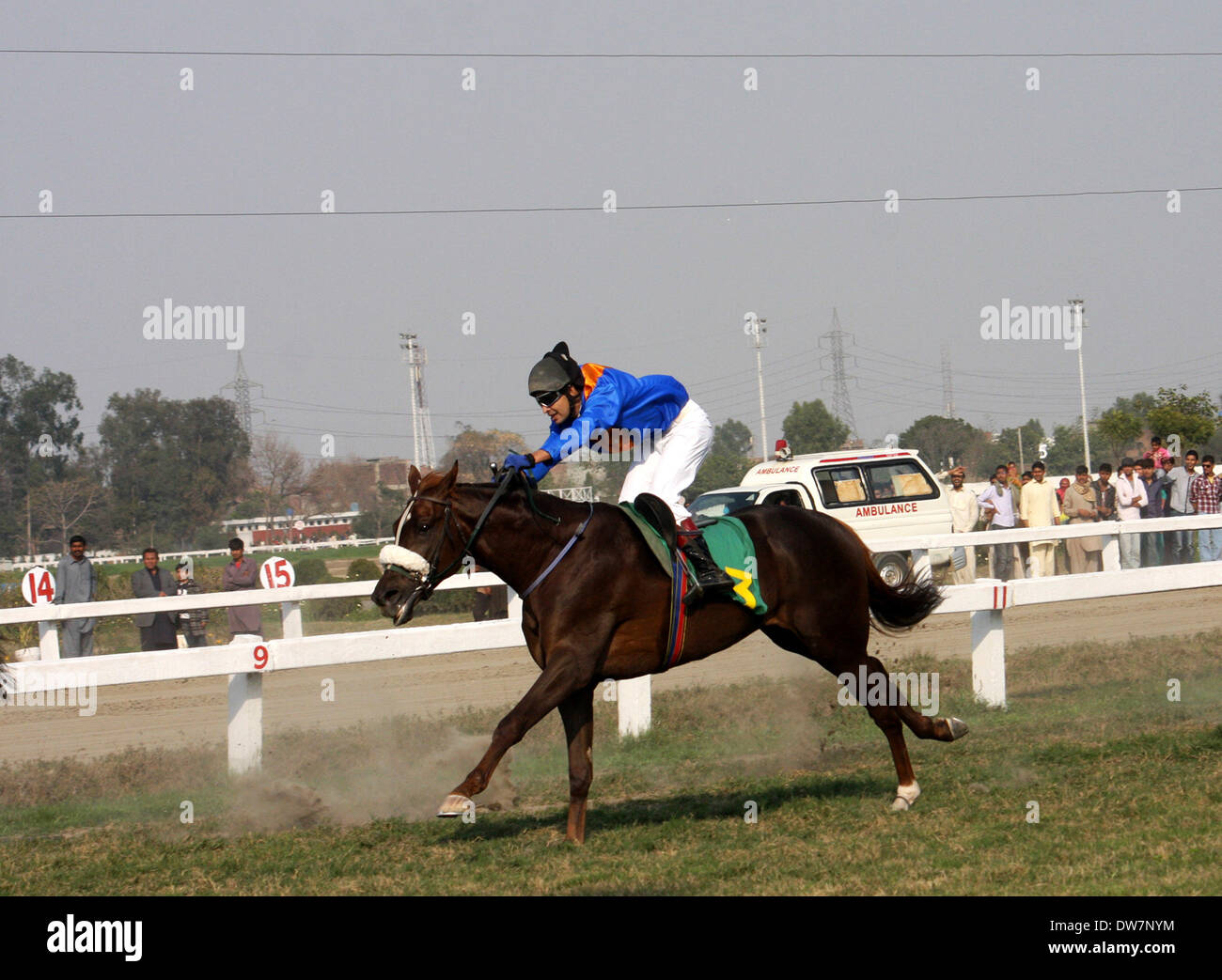 Lahore. 2nd Mar, 2014. A Pakistani jockey rides his horse during the