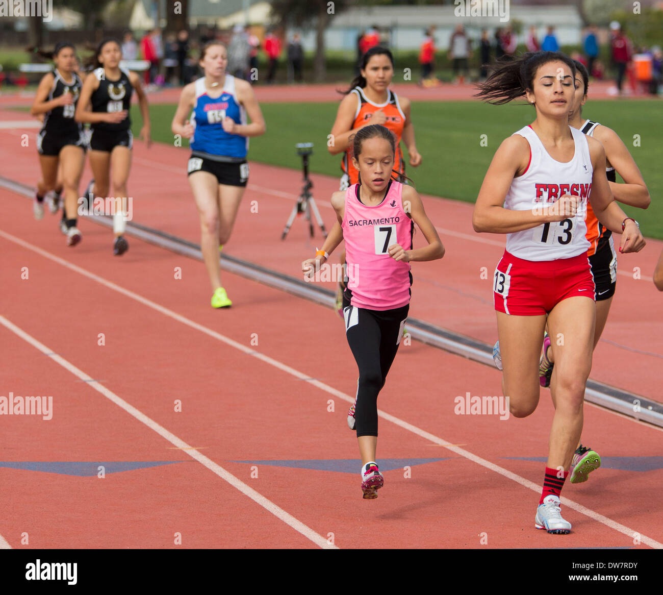 Turlock, CA, USA. 1st Mar, 2014. 11 yr old Isabella Fauria(7) of Sacramento Ca runs the 1500m run during the Kim Duyst Invitational at CSU Stanislaus on March 1st 2014. Competing against college athletes she finished 12 out of 46 runners in the event with a time of 4:59.09. Fauria also ran the 800m run in 2:29.54 and finished 3rd in her heat and finished 26th out of 46 runners. Credit:  Marty Bicek/ZUMAPRESS.com/Alamy Live News Stock Photo