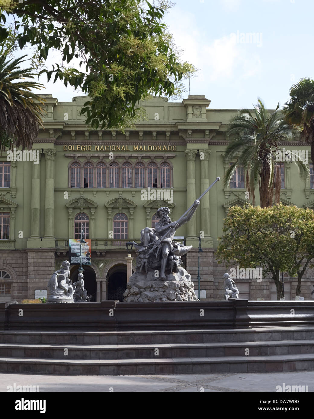 Parque Sucre with a fountain and the Colegio Nacional Maldonado in the background in the city center of Riobamba, Ecuador Stock Photo