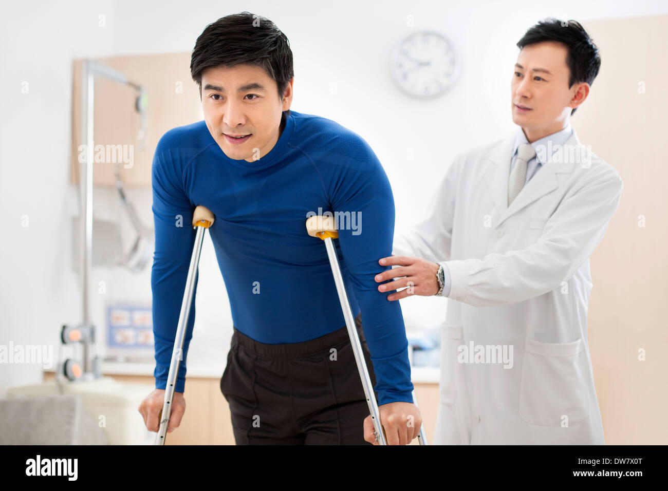 Patient with crutches Stock Photo Alamy