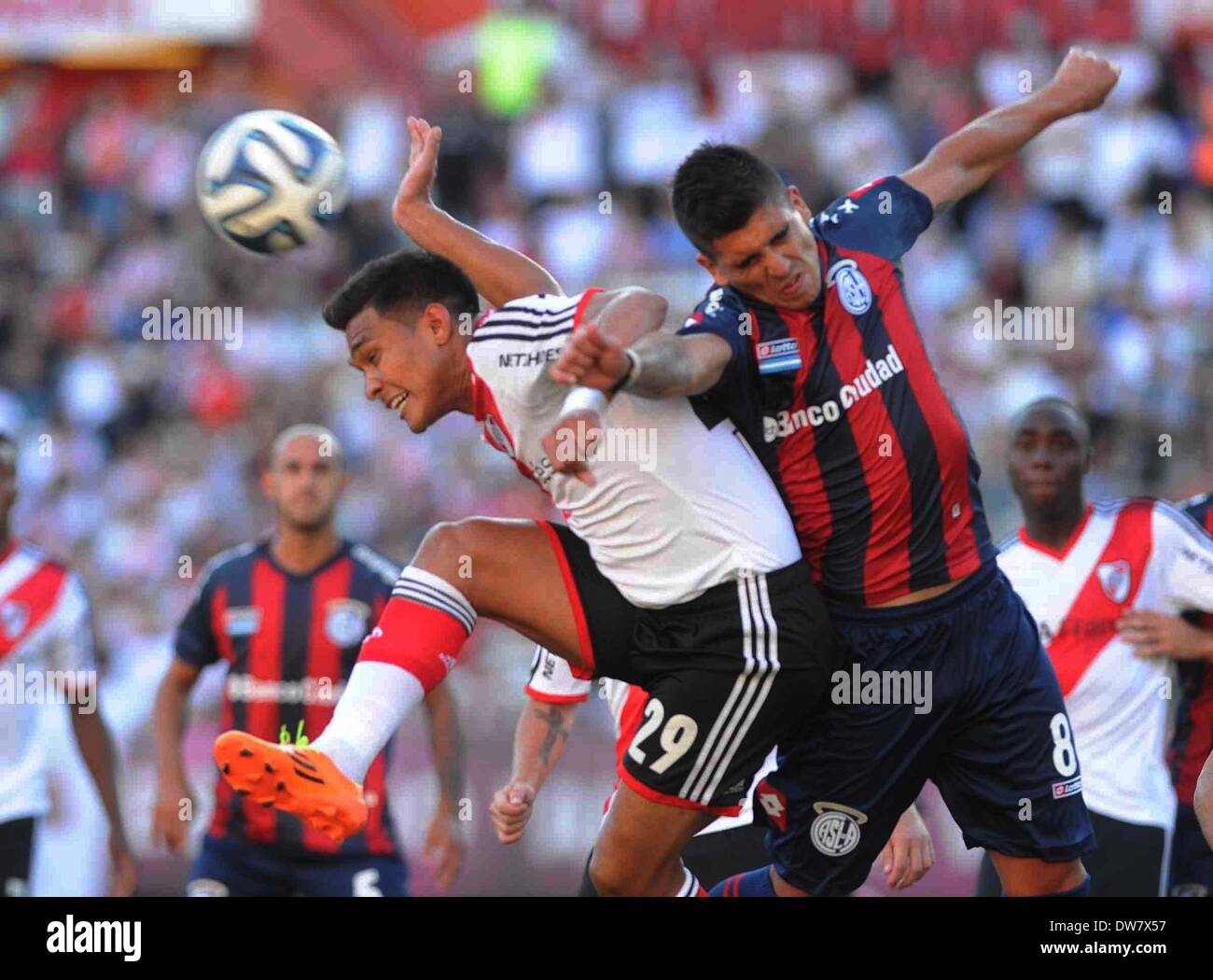 Buenos Aires, Argentina. 2nd Mar, 2014. Teofilo Gutierrez (L) of River Plate vies for the ball with Enzo Kalinski (R) of San Lorenzo during their match of the Final Tournament held at Monumental Stadium, in Buenos Aires, Argentina, on March 2, 2014. Credit:  Maximiliano Luna/TELAM/Xinhua/Alamy Live News Stock Photo