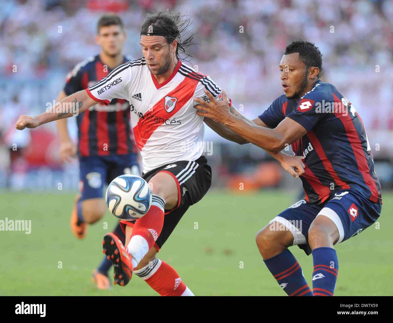 Buenos Aires, Argentina. 2nd Mar, 2014. Fernando Cavenaghi (L) of River Plate vies for the ball with Carlos Valdes (R) of San Lorenzo during their match of the Final Tournament held at Monumental Stadium, in Buenos Aires, Argentina, on March 2, 2014. Credit:  Maximiliano Luna/TELAM/Xinhua/Alamy Live News Stock Photo