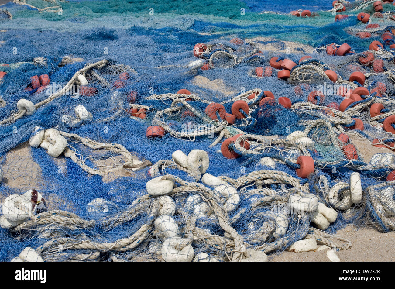 Old blue fishing nets of fishermen from Ghana Africa background Stock