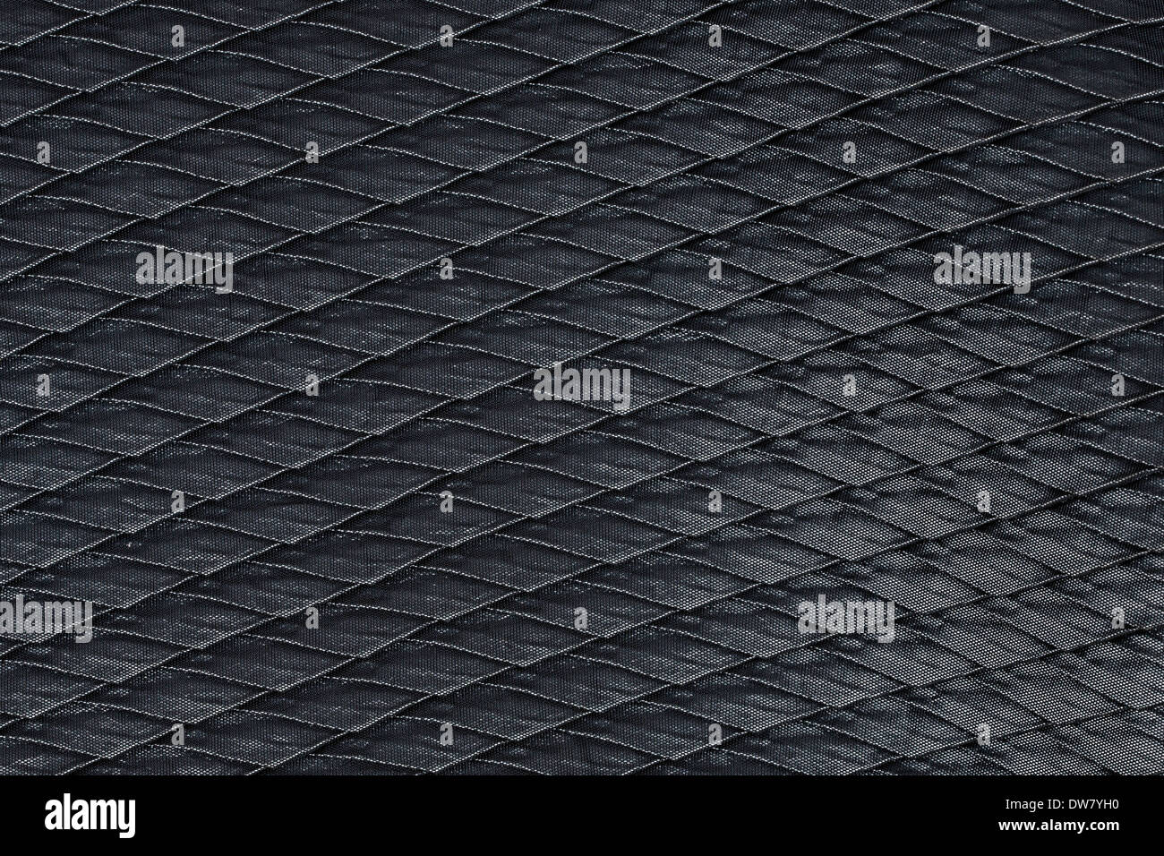Fabric texture with grid pattern, red squares and black squares