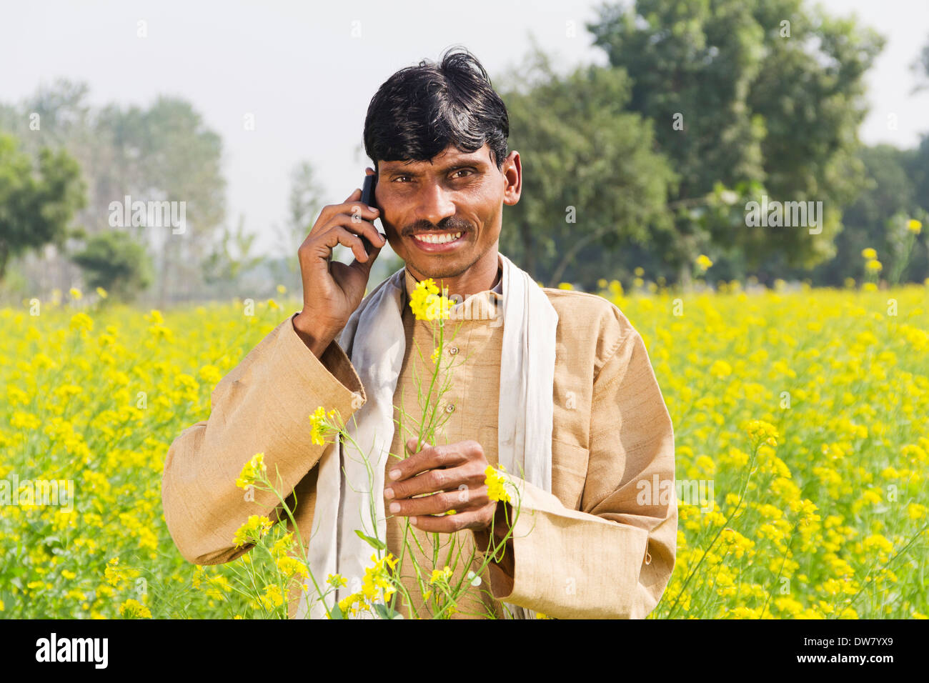 1 Indian farmer standing in farms and talking Stock Photo - Alamy